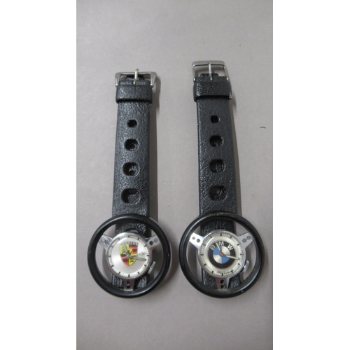 317 - Old England Porsche and BMW manual wind wristwatches - both needing attention