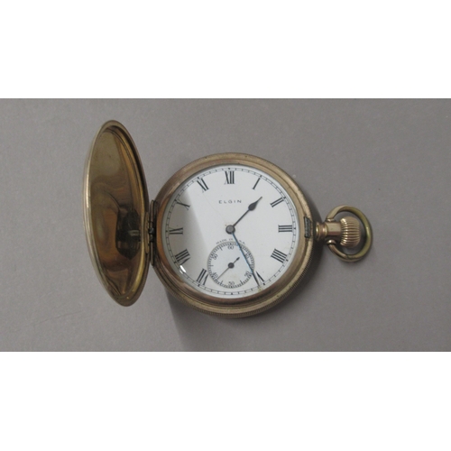 319 - An Elgin gold plated full hunter pocket watch - 5cm diameter - working in the saleroom