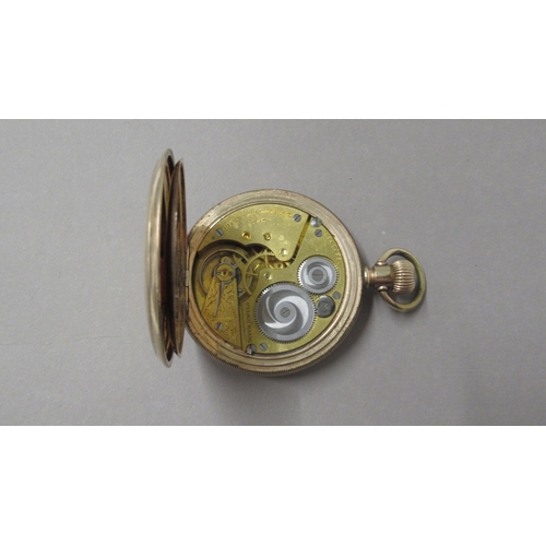 319 - An Elgin gold plated full hunter pocket watch - 5cm diameter - working in the saleroom