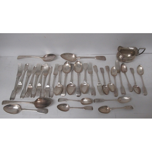 325 - A quantity of silver flatware, various GB hallmarks, 31 pieces and a silver cream jug, approx 42 tro... 