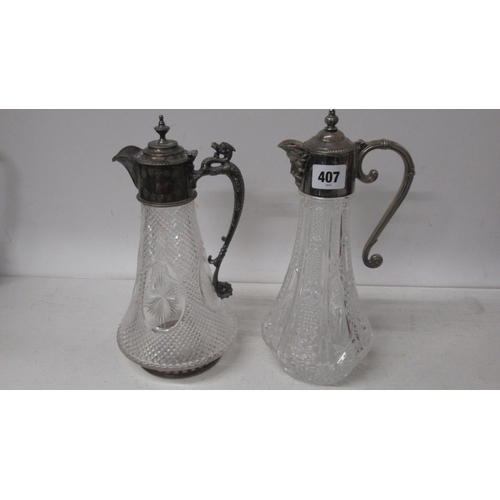 407 - Two claret jugs with silver plated top