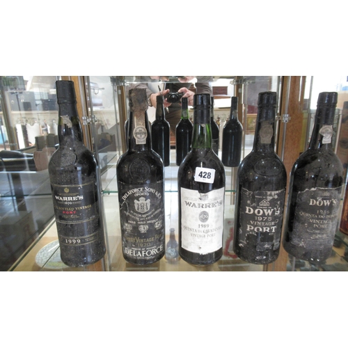 428 - Five bottles of Port including two Dow's 1986 and 1975 two Warre's 1989 and 1999 and Delaforce 1970