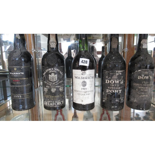 428 - Five bottles of Port including two Dow's 1986 and 1975 two Warre's 1989 and 1999 and Delaforce 1970