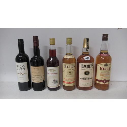 439 - Three bottles of Scotch whisky together with a bottle of sherry and two bottles of wine