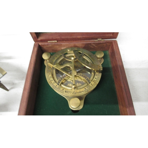 448 - A brass sextant - Henry Barrow & Co London - 22cm - and a brass sundial compass 11cm - boxed