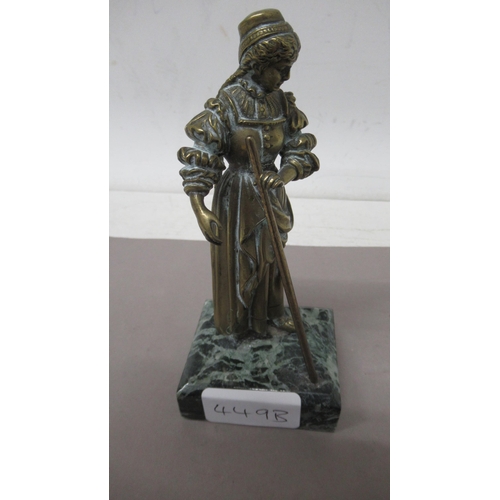 449B - A small bronze figure of a lady on green marble base - 14cm