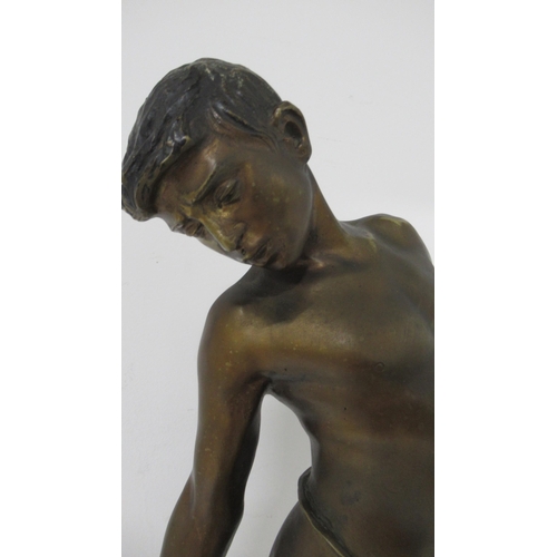 450 - A bronze figure of a boy with crab signed Delotto - Annibale De Lotto - good patina on square grey m... 