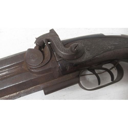 451 - A 19th century unnamed 28 bore double barrelled over and under Howdah pistol with engraved hammer, r... 