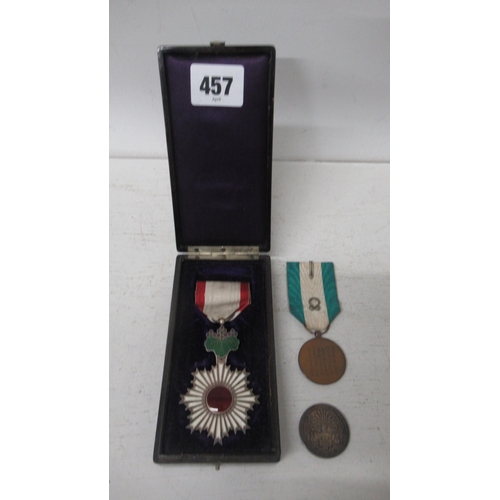 457 - A Japanese Order of the Rising Sun Medal in Lacquer box together with a Japanese Red Cross silver co... 