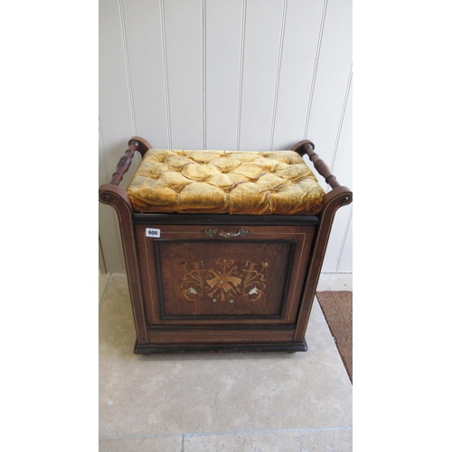 600 - An Edwardian mahogany and inlaid music stool with a fall front