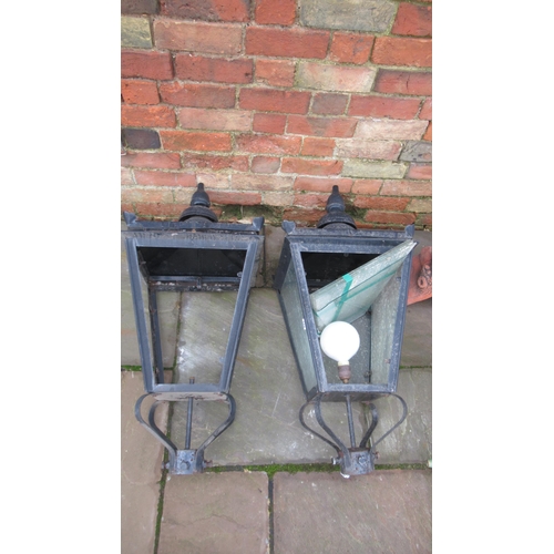 627 - A pair of 19th century style lamp post tops - one piece of glass broken in one lamp