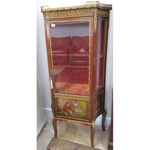 597 - A Continental mahogany and ormolu display cabinet with a single door, 140cm high x 68cm wide