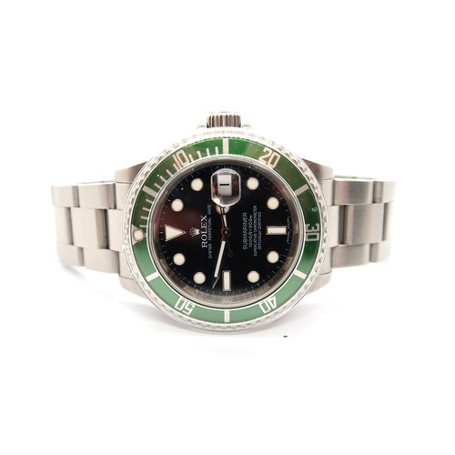 A Rolex Submariner 16610LV Kermit 2009 serial number V 185736 with box, papers and swing tag - in very good condition - 40mm dial with its plastic guard
