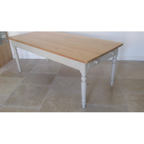 610 - A 19th century pine kitchen table with one drawer and a dummy drawer painted base and re-polished to... 