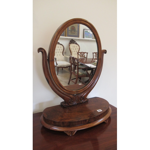 620 - A 19th century mahogany oval dressing table mirror - Height 65cm