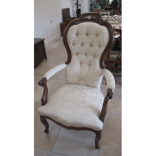 624 - A Victorian style spoon back armchair - in good condition