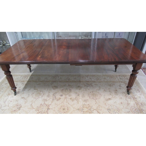 625 - A 19th century mahogany dining table with two leaves on reeded legs - Length 220cm x Width 103cm - i... 