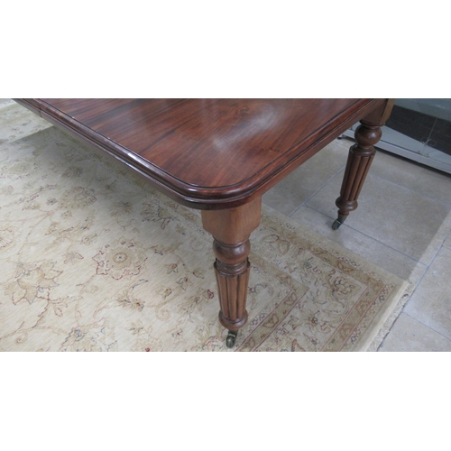 625 - A 19th century mahogany dining table with two leaves on reeded legs - Length 220cm x Width 103cm - i... 