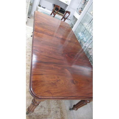 625 - A 19th century mahogany dining table with two leaves on reeded legs - Length 220cm x Width 103cm - i... 