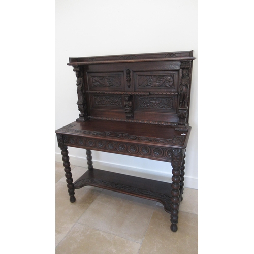 639 - A 1930's heavily carved oak side cabinet - Width 115cm x 140cm