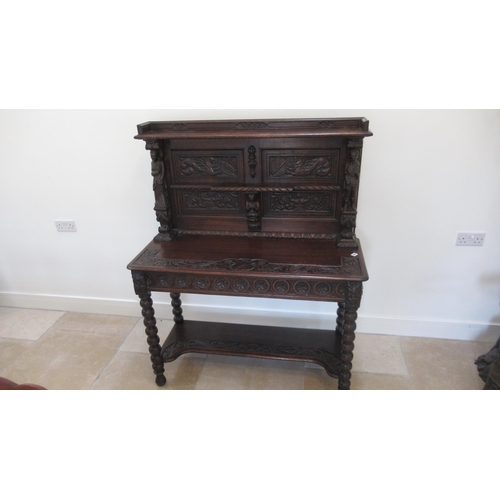 639 - A 1930's heavily carved oak side cabinet - Width 115cm x 140cm