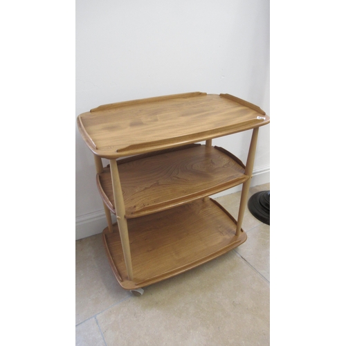 645 - An Ercol blonde two tier tea trolley on wheels - Width 70cm x Height 78cm