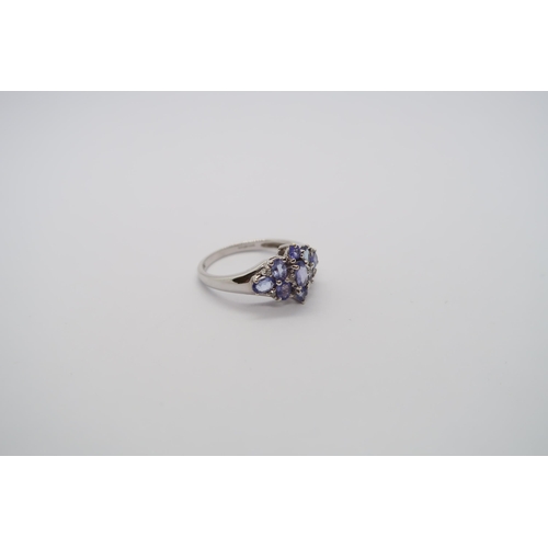 31 - A 9ct white gold tanzanite and diamond ring, head size approx 16mm x 12mm, size O/P