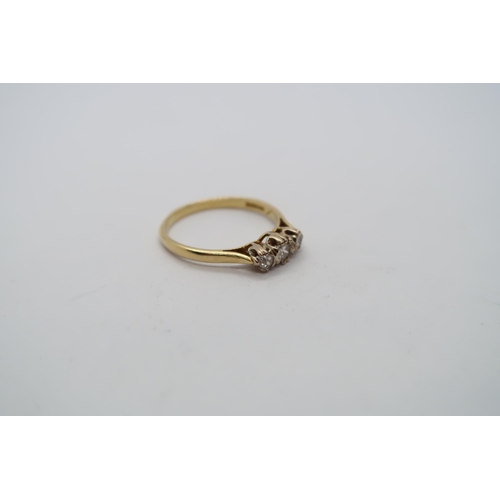 36 - A hallmarked 18ct yellow gold three stone diamond ring, size P, approx 2.6 grams