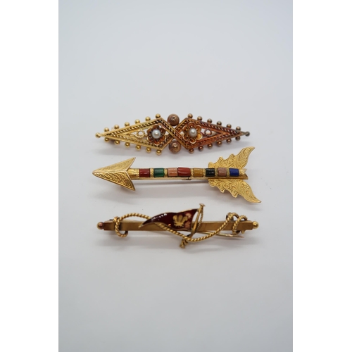 39 - Three gold brooches; Etruscan revival with seed pearls, 5cm, a 15ct hallmarked gold and enamel 4.5cm... 