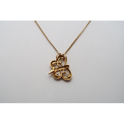 41 - A hallmarked 9ct yellow gold butterfly pendant on a 9ct hallmarked chain, pendant 2cm set with perid... 