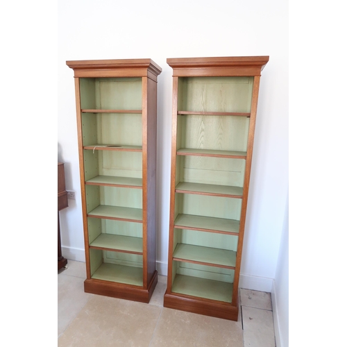 612A - A pair of slim walnut bookcases with five adjustable shelves - 180cm x 52cm x 26cm deep- made by a l... 