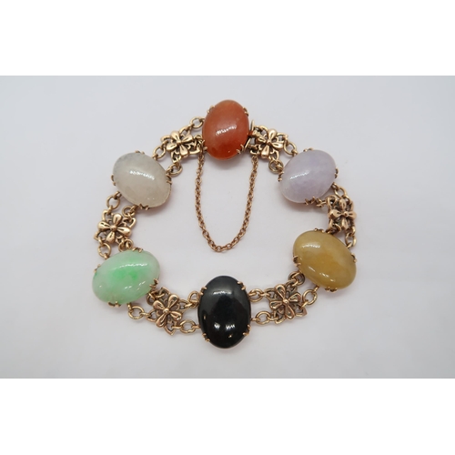 69 - A hallmarked 9ct yellow gold hardstone bracelet, approx 18.8 grams