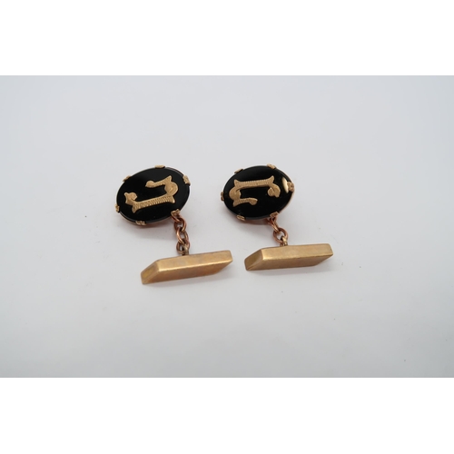 80 - A pair of 9ct hallmarked yellow gold and black onyx cufflinks, approx 7.1 grams