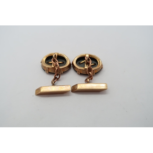 80 - A pair of 9ct hallmarked yellow gold and black onyx cufflinks, approx 7.1 grams