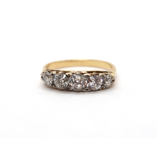 A ladies 18ct yellow gold ring set with five diamonds - ring size P - total diamond weight approx 1.2ct, colour J, clarity SI2