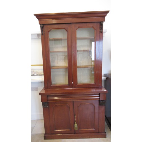 637 - A 19th century mahogany cupboard bookcase in good condition - Height 210cm x Width 105cm