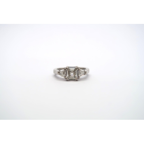 75 - A very good platinum three stone diamond ring - The square emerald cut diamond estimated 1.1ct, clar... 