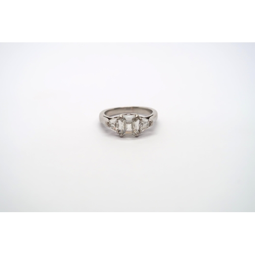 75 - A very good platinum three stone diamond ring - The square emerald cut diamond estimated 1.1ct, clar... 