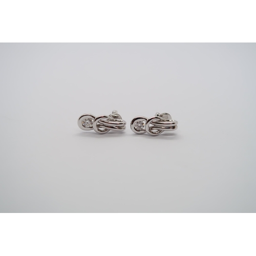 91 - A pair of good quality 18ct white gold diamond Love Knot earrings, colour approx G/H, VS1, head size... 