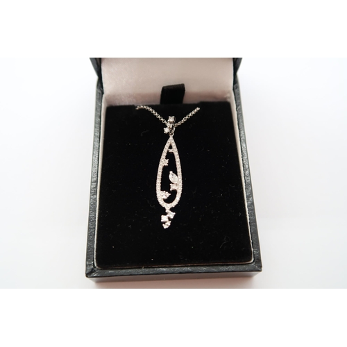 An 18ct white gold diamond pendant - ex jewellers stock, as new condition - RRP £750