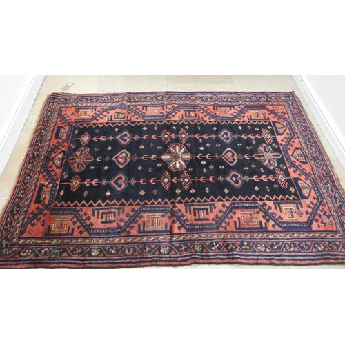 586 - A hand knotted woollen Luri rug - 2.13m x 1.48m