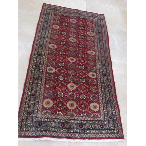 585 - A hand knotted woollen Veramin rug - 1.94m x 1.00m