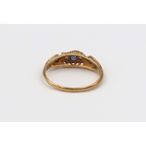 102 - An 18ct diamond and sapphire dress ring, approx 2 grams