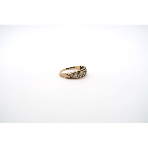 17 - A 9ct yellow gold ring set with 9 white sapphires to shoulder, size J, approx 1.8 grams