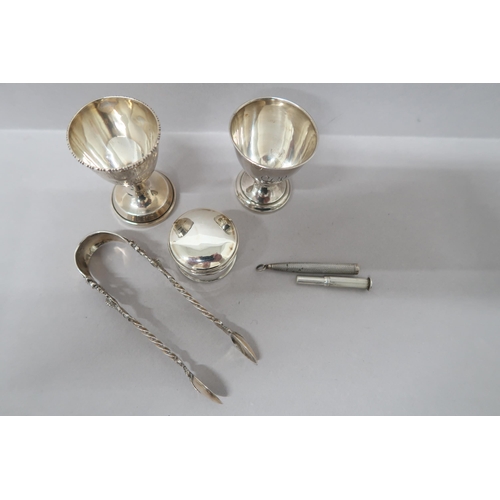 375 - Two silver Christening  egg cups, pill box and sugar nips along with a silver propelling pencil, Bir... 