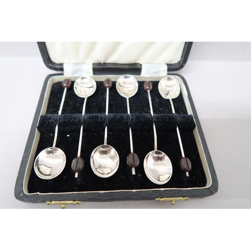 377 - A cased set of coffee bean spoons