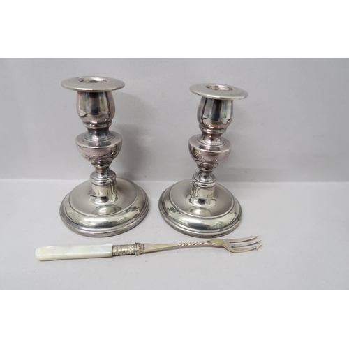 379 - A pair of silver plated candlesticks and toasting fork