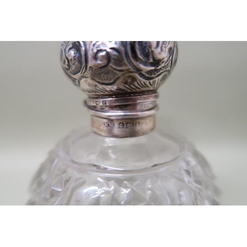 393 - A cut glass scent bottle with silver lid and glass stopper, overall height 13cm