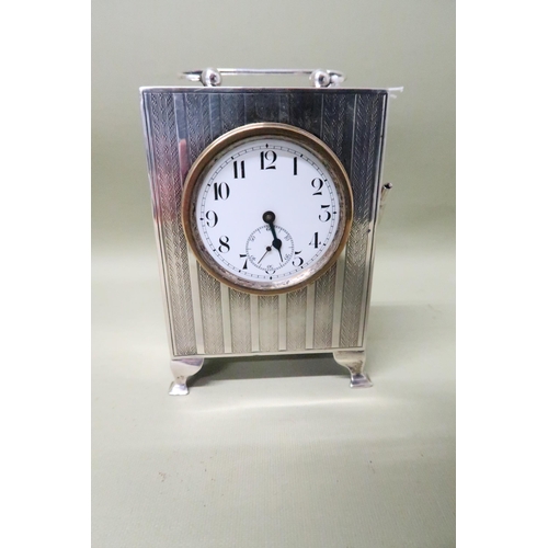 399 - A solid silver cased clock - Birmingham 1938