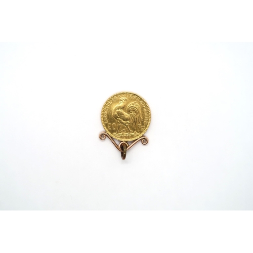 421 - A 1913 gold 20 Franc coin in a mount - total weight approx 7 grams